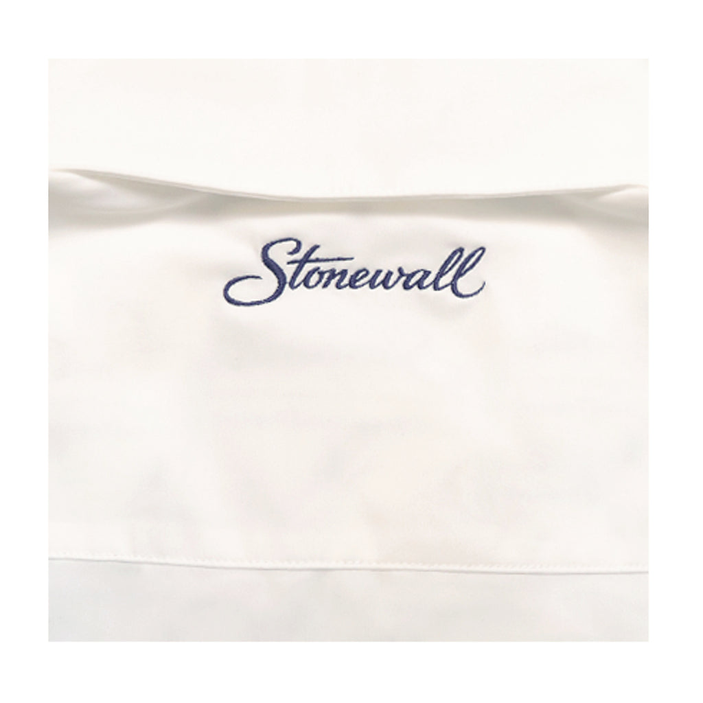 An off-white nylon button up featuring the word 'Stonewall' embroidered in navy blue cursive script across the upper portion.